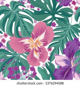 Tropcal flowers and palm leaves seamless pattern. Beautiful floral background. Summer nature wallpaper.