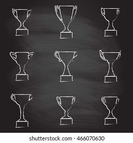 Trophy Cup icon set isolated on blackboard texture with chalk rubbed background. Vector illustration.