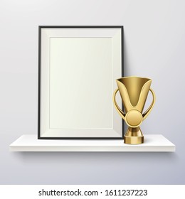 Trophy and frame realistic composition with pure wall with shelf golden cup and empty photo frame vector illustration