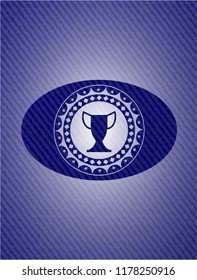 trophy icon inside badge with denim background