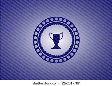 trophy icon inside badge with denim background