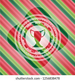 trophy icon inside christmas badge background.