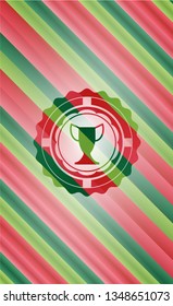 trophy icon inside christmas colors style badge.