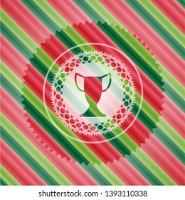 trophy icon inside christmas colors badge.