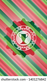 trophy icon inside christmas colors badge.