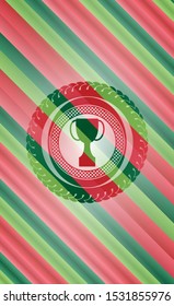trophy icon inside christmas emblem.