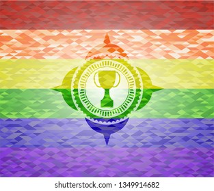 trophy icon inside emblem on mosaic background with the colors of the LGBT flag