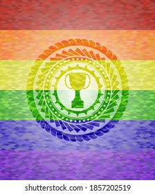 trophy icon inside emblem on mosaic background with the colors of the LGBT flag. 