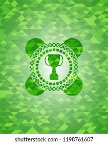trophy icon inside green emblem with triangle mosaic background