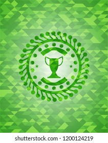 trophy icon inside green emblem with triangle mosaic background