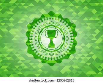 trophy icon inside green emblem with mosaic ecological style background