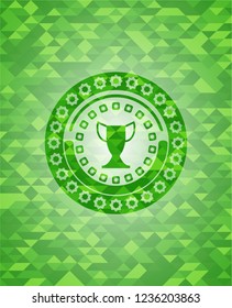trophy icon inside green emblem. Mosaic background