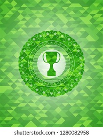 trophy icon inside green emblem with mosaic background