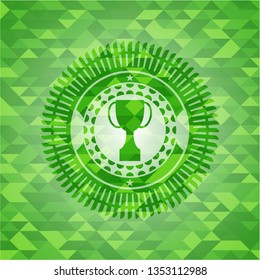 trophy icon inside green emblem with mosaic background