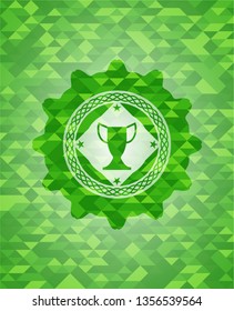 trophy icon inside green emblem with mosaic ecological style background