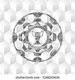 trophy icon inside grey badge with geometric cube white background