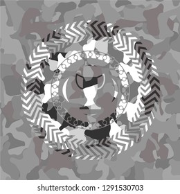 trophy icon inside grey camo emblem