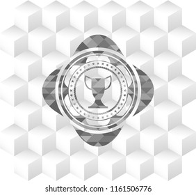 trophy icon inside grey emblem with cube white background