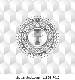 trophy icon inside grey emblem with cube white background