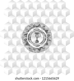 trophy icon inside grey emblem with cube white background