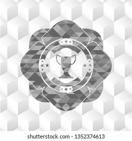 trophy icon inside grey emblem with geometric cube white background