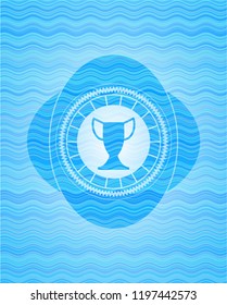 trophy icon inside light blue water wave badge.