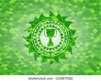 trophy icon inside realistic green emblem. Mosaic background
