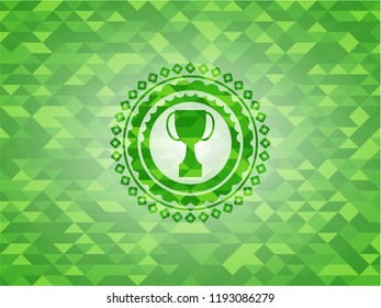 trophy icon inside realistic green emblem. Mosaic background