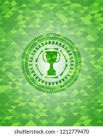 trophy icon inside realistic green mosaic emblem