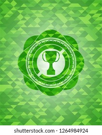 trophy icon inside realistic green emblem. Mosaic background