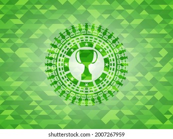 trophy icon inside realistic green emblem. Mosaic background. 