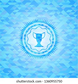 trophy icon inside realistic light blue emblem. Mosaic background