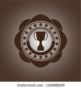 trophy icon inside realistic wood emblem