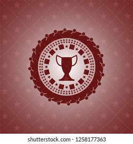 trophy icon inside red emblem