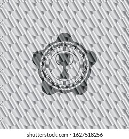 trophy icon inside silver emblem or badge. Scales pattern. Vector Illustration. Detailed.