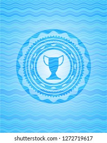 trophy icon inside sky blue water emblem background.