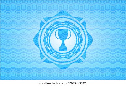 trophy icon inside sky blue water wave emblem.