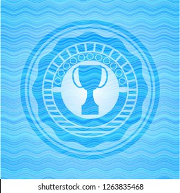 trophy icon inside water concept badge background.