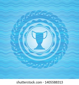 trophy icon inside water concept style emblem.