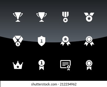 Trophy icons on black background. Vector illustration.