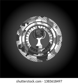 trophy with money symbol inside icon inside grey camouflaged emblem