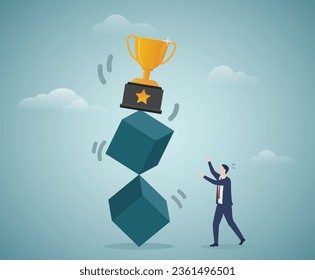 The trophy is shaky on the cubes, and the merchant is worrying about it.Risk and Honor business concept