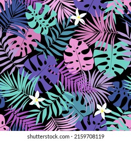 Tropic leaves seamless pattern in purple, blue and pink colors with white flowers