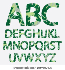 Tropical alphabet made of monstera palm leaves. Hand drawn green paradice abc. Natural summer letters. Vector illustrated design