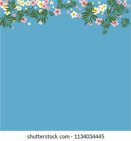 Tropical background with hibiscus flowers and tropical leaves.