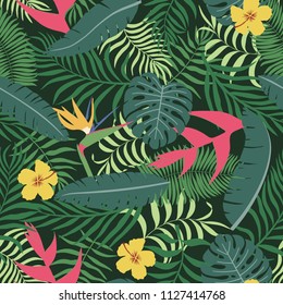 Tropical background with palm leaves and flowers. Seamless floral pattern. Summer vector illustration