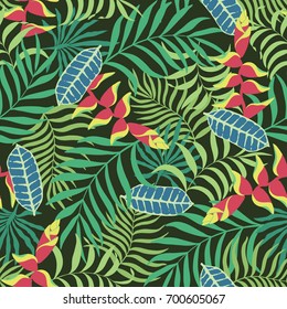 Tropical background with palm leaves and flowers. Seamless floral pattern