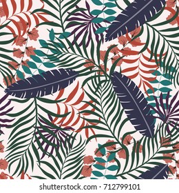 Tropical background with palm leaves. Seamless floral pattern