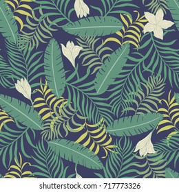 Tropical background with palm leaves. Seamless floral pattern