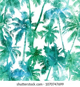 Tropical background seamless pattern of green silhouettes coconut palms on a white background